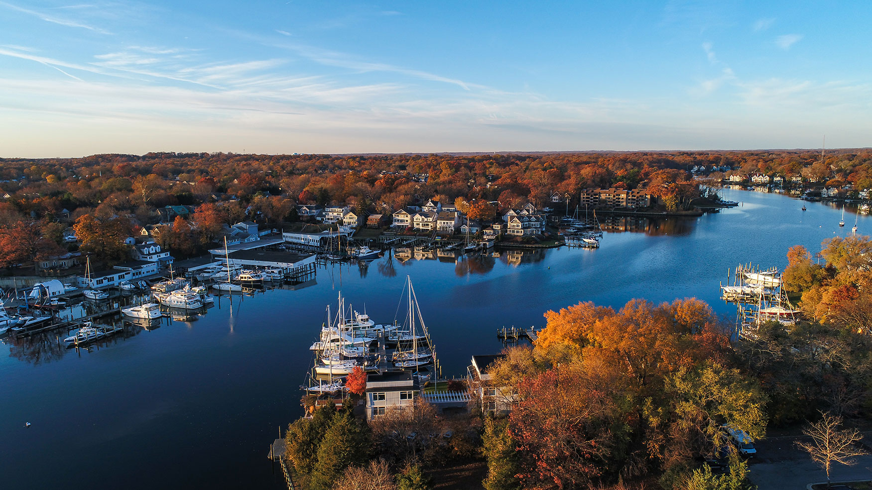 Houses and boats along the Annapolis riverfront in fall